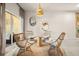 Charming sitting area features wicker chairs, a round rug, and an airy atmosphere at 3061 Beach Palm Ave, Kissimmee, FL 34747