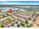 Aerial view of the community showing the property's location near a lake and other community amenities at 3193 Pequod Pl, Kissimmee, FL 34746