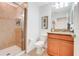 Bathroom featuring a tiled shower, granite countertops, and white porcelain toilet at 3193 Pequod Pl, Kissimmee, FL 34746
