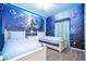 Themed bedroom with vibrant underwater mural, creating a magical space for children or guests at 3193 Pequod Pl, Kissimmee, FL 34746