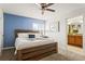 Inviting bedroom with a comfortable bed, ceiling fan, and ample natural light, creating a warm atmosphere at 3193 Pequod Pl, Kissimmee, FL 34746