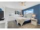 Comfortable bedroom with blue accent wall, plush bedding, and ample natural light at 3193 Pequod Pl, Kissimmee, FL 34746