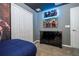 Themed bedroom featuring comic book superhero design, complete with coordinating bedding and decor at 3193 Pequod Pl, Kissimmee, FL 34746