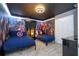 Themed bedroom featuring comic book superhero design, complete with coordinating bedding and decor at 3193 Pequod Pl, Kissimmee, FL 34746