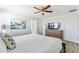 Comfortable bedroom with a modern dresser, a soft bed, and stylish décor for a relaxing retreat at 3193 Pequod Pl, Kissimmee, FL 34746
