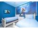 Themed bedroom with vibrant underwater mural, creating a magical space for children or guests at 3193 Pequod Pl, Kissimmee, FL 34746