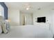 Bright bedroom featuring a ceiling fan, white walls, and modern furnishings at 3193 Pequod Pl, Kissimmee, FL 34746