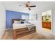 Bedroom with a wooden bed frame and a window with a view at 3193 Pequod Pl, Kissimmee, FL 34746