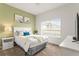 Cozy bedroom with a plush bed, soft carpet, and ample natural light from a large window at 3193 Pequod Pl, Kissimmee, FL 34746