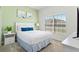 Serene bedroom with a large window, soft carpet, and a comfy bed for ultimate relaxation at 3193 Pequod Pl, Kissimmee, FL 34746