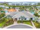 Beautiful community clubhouse with a pool, a lazy river, palm trees and nearby apartments at 3193 Pequod Pl, Kissimmee, FL 34746