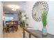 Inviting dining room featuring a rustic wood table and chairs, complemented by tile flooring and bright, natural lighting at 3193 Pequod Pl, Kissimmee, FL 34746