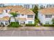 Aerial view of a well-maintained two-story home with a tile roof, complemented by lush landscaping at 3193 Pequod Pl, Kissimmee, FL 34746