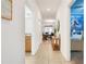 Bright hallway with tile floors, leading to bedroom and dining area, creating an open and airy feel at 3193 Pequod Pl, Kissimmee, FL 34746