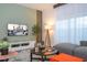 Comfortable living area showcasing a modern TV, sleek entertainment center, decorative accents, and natural lighting at 3193 Pequod Pl, Kissimmee, FL 34746