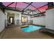 Relaxing outdoor pool area enclosed with a screen, featuring a small pool with a patio at 3193 Pequod Pl, Kissimmee, FL 34746