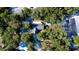 Aerial shot of house surrounded by dense tree cover, offering privacy at 32645 Red Oak Dr, Eustis, FL 32736