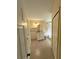 Bathroom featuring vanity with white cabinets, decorative mirror, and tile flooring at 32645 Red Oak Dr, Eustis, FL 32736
