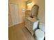 Bathroom features white vanity, marble countertop, tiled floors and linen closet at 32645 Red Oak Dr, Eustis, FL 32736