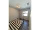 Minimalist bedroom with a bed frame, closet and tile floor at 32645 Red Oak Dr, Eustis, FL 32736