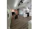 Open living area with dining space featuring wood floors and natural light at 32645 Red Oak Dr, Eustis, FL 32736