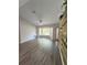 Bright living room featuring a bay window and wood-look flooring at 32645 Red Oak Dr, Eustis, FL 32736