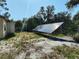 This property features a solar panel array, an environmentally friendly solution for energy efficiency and cost savings at 32645 Red Oak Dr, Eustis, FL 32736