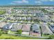 Aerial view of a residential area highlighting the well-planned community layout and nearby lake at 3454 Somerset Park Dr # 36, Orlando, FL 32824