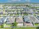 Expansive aerial view highlighting the neighborhood, nearby lake, and the surrounding landscape on a sunny day at 3454 Somerset Park Dr # 36, Orlando, FL 32824