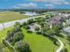 Overhead shot of a neighborhood park with playground, green space, and walking paths near a residential area at 3454 Somerset Park Dr # 36, Orlando, FL 32824