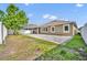 Spacious backyard features a stone paver patio, a screened-in lanai, and a pristine white fence at 3454 Somerset Park Dr # 36, Orlando, FL 32824