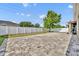 Enjoy the outdoors in this spacious backyard with a stone paver patio and a pristine white fence at 3454 Somerset Park Dr # 36, Orlando, FL 32824