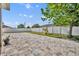 A beautiful, spacious backyard with a stone paver patio and a white fence, great for entertaining at 3454 Somerset Park Dr # 36, Orlando, FL 32824