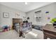 bedroom with a wooden crib, toy organizers, and a large window at 3454 Somerset Park Dr # 36, Orlando, FL 32824
