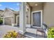Inviting front porch with stylish door, stone accents, and well-maintained landscaping create an appealing entrance at 3454 Somerset Park Dr # 36, Orlando, FL 32824