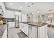 Well-equipped kitchen with stainless steel appliances, granite countertops, white cabinets, and modern fixtures at 3454 Somerset Park Dr # 36, Orlando, FL 32824