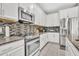 Well-equipped kitchen featuring stainless steel appliances and granite countertops at 3454 Somerset Park Dr # 36, Orlando, FL 32824