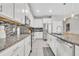 Bright kitchen with white cabinets, stainless steel appliances, granite countertops, and a stylish backsplash at 3454 Somerset Park Dr # 36, Orlando, FL 32824