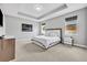 Serene main bedroom with tray ceiling and comfortable carpeted floor at 3454 Somerset Park Dr # 36, Orlando, FL 32824