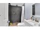 Updated bathroom with a tiled shower, white vanity, and modern fixtures at 4051 Crofford Ave, Haines City, FL 33844