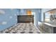 Bedroom with fun cloud-like painted walls, bed and matching dresser at 4051 Crofford Ave, Haines City, FL 33844