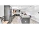 Bright and modern kitchen with wood-look tile and a large kitchen island at 4051 Crofford Ave, Haines City, FL 33844