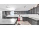 Bright kitchen featuring stainless steel appliances, granite countertops, and wood-look tile flooring at 4051 Crofford Ave, Haines City, FL 33844