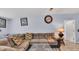 Cozy Living Room with a large sofa, wood-look tile floors, and modern decor at 4051 Crofford Ave, Haines City, FL 33844