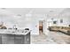 Open-concept living space with granite countertops and a comfortable living room setup at 4051 Crofford Ave, Haines City, FL 33844