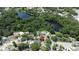 Aerial view of a neighborhood highlighting the pool and mature landscaping at 422 S Hawthorn Cir, Winter Springs, FL 32708