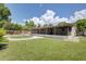 Backyard with lawn and swimming pool perfect for entertaining at 422 S Hawthorn Cir, Winter Springs, FL 32708
