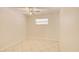 Bright bedroom with tiled floors, a ceiling fan, and a window providing natural light at 422 S Hawthorn Cir, Winter Springs, FL 32708
