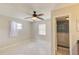 A spacious bedroom with neutral paint, ceiling fan and an ensuite bathroom for added convenience at 422 S Hawthorn Cir, Winter Springs, FL 32708