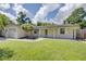 Inviting exterior of a cozy home with a lush green lawn and an attached garage at 422 S Hawthorn Cir, Winter Springs, FL 32708